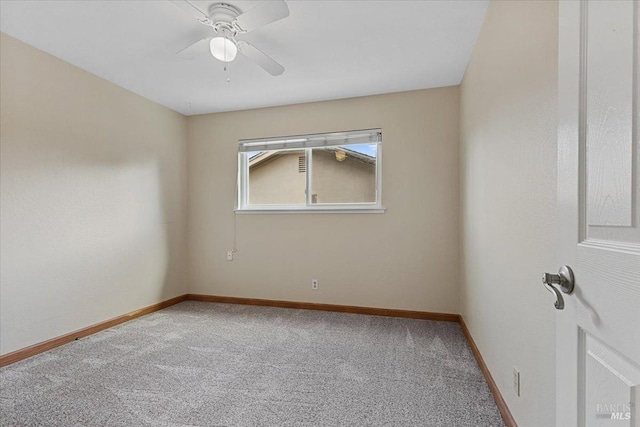 carpeted empty room with ceiling fan