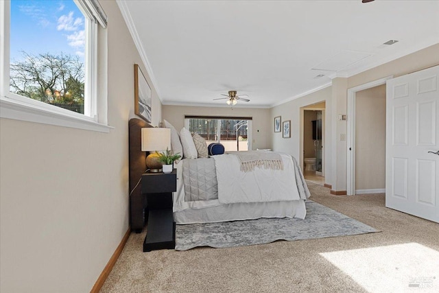 carpeted bedroom featuring crown molding and ceiling fan