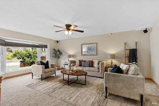 carpeted living room with ceiling fan