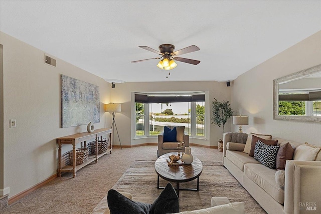 carpeted living room with plenty of natural light and ceiling fan