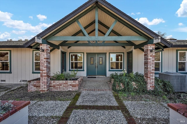 property entrance with central AC and a porch