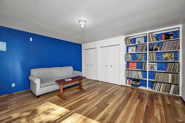 sitting room with hardwood / wood-style flooring