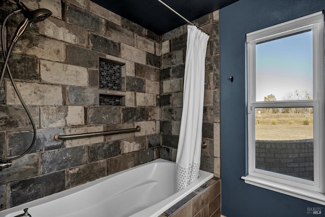 bathroom featuring shower / bath combo with shower curtain