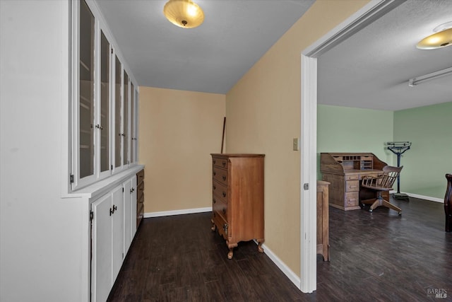 hall with dark wood-type flooring