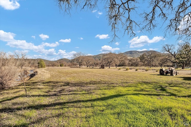 property view of mountains featuring a rural view