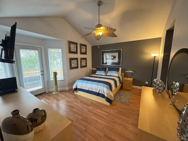 bedroom featuring lofted ceiling, hardwood / wood-style floors, ceiling fan, and access to exterior