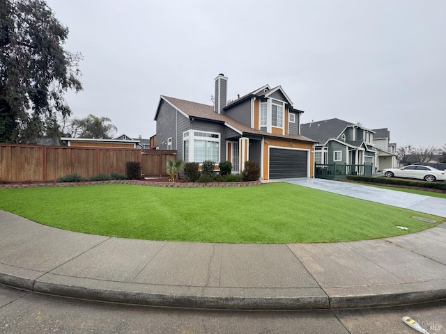 front of property featuring a garage and a front lawn