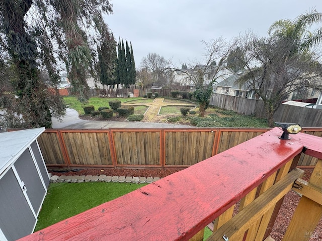 wooden deck featuring a yard