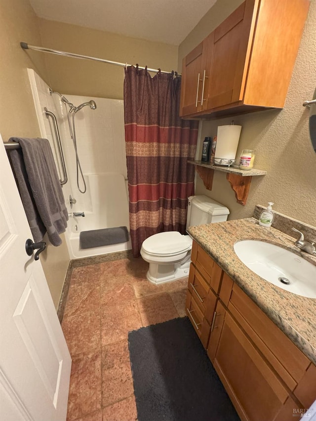 full bathroom featuring toilet, vanity, and shower / bath combo with shower curtain