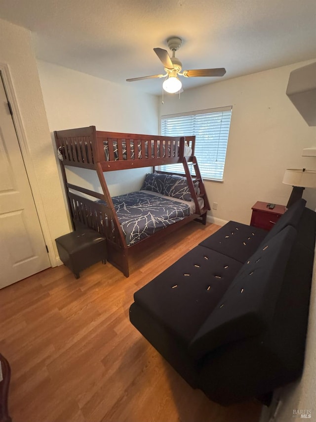 bedroom featuring ceiling fan and hardwood / wood-style floors