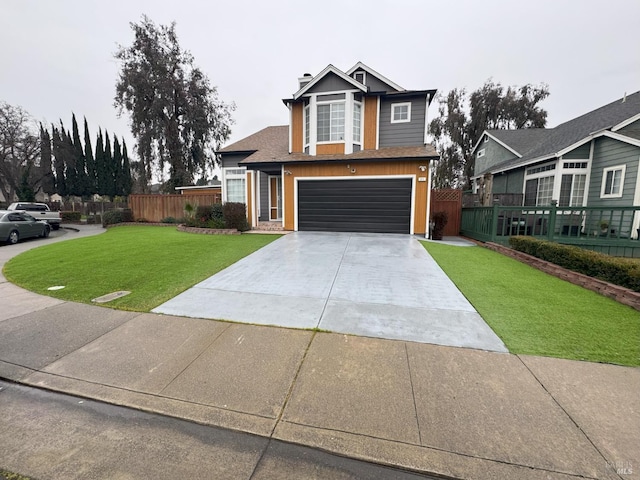 view of front of home featuring a garage and a front lawn