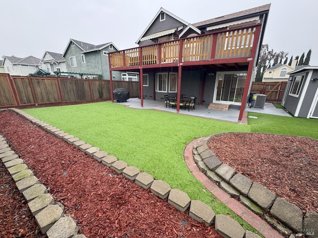 back of property featuring cooling unit, a deck, a patio, and a lawn