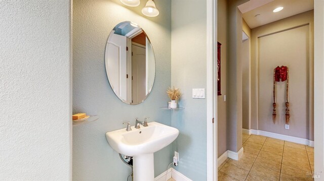 bathroom featuring tile patterned flooring and sink