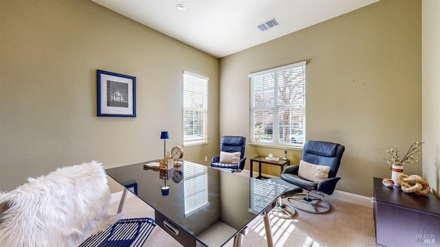 office with carpet, visible vents, and baseboards