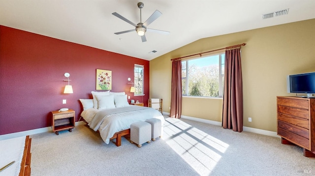 bedroom featuring lofted ceiling, baseboards, visible vents, and light colored carpet