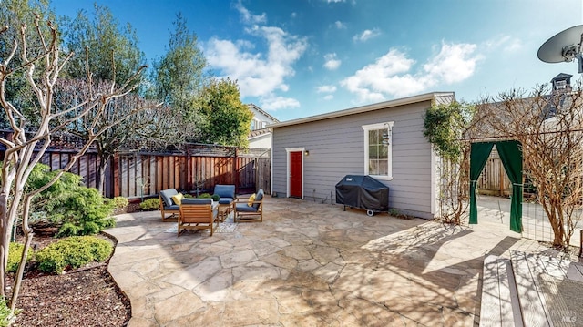 view of patio with a grill and a fenced backyard