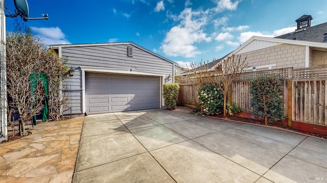 garage with fence