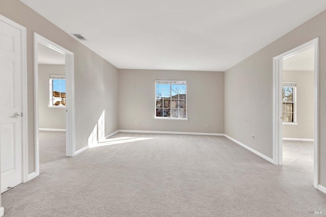 empty room featuring light colored carpet