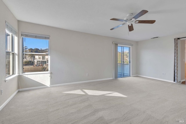 carpeted empty room with ceiling fan