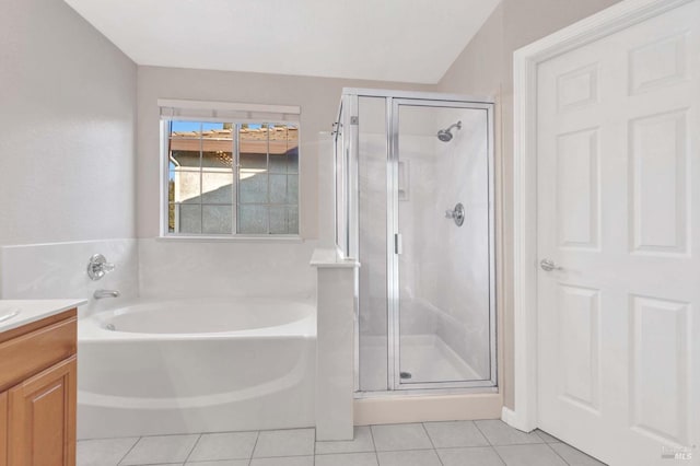 bathroom featuring vanity, shower with separate bathtub, and tile patterned floors