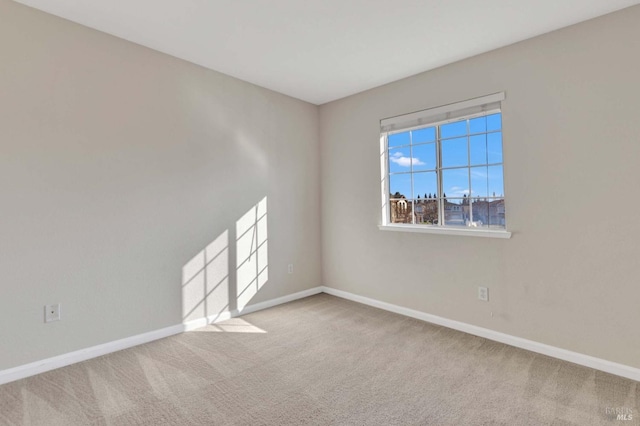 unfurnished room featuring carpet floors