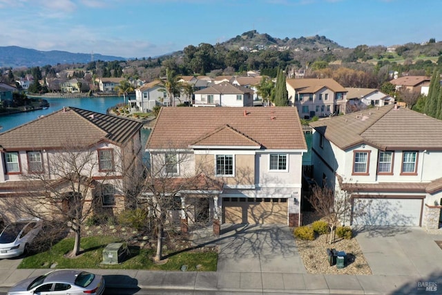 bird's eye view featuring a water and mountain view