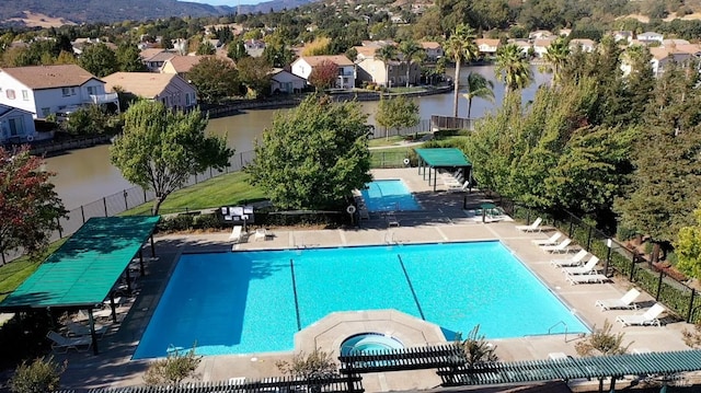 view of pool with a hot tub and a patio