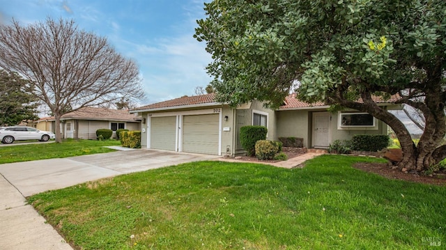 ranch-style home featuring a tile roof, concrete driveway, a front yard, and stucco siding