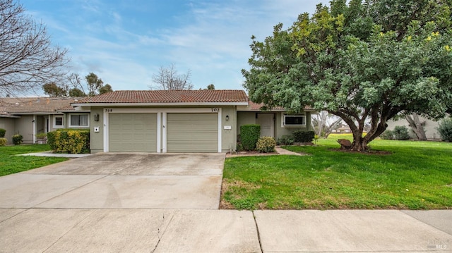 ranch-style home featuring a tile roof, concrete driveway, a front yard, stucco siding, and an attached garage