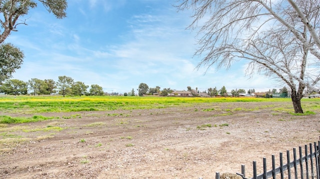 view of yard with a rural view