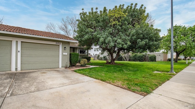 exterior space with concrete driveway and a garage