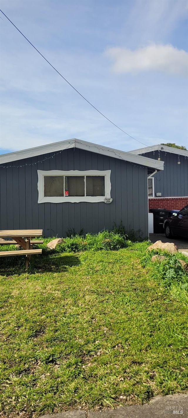 view of property exterior featuring a yard