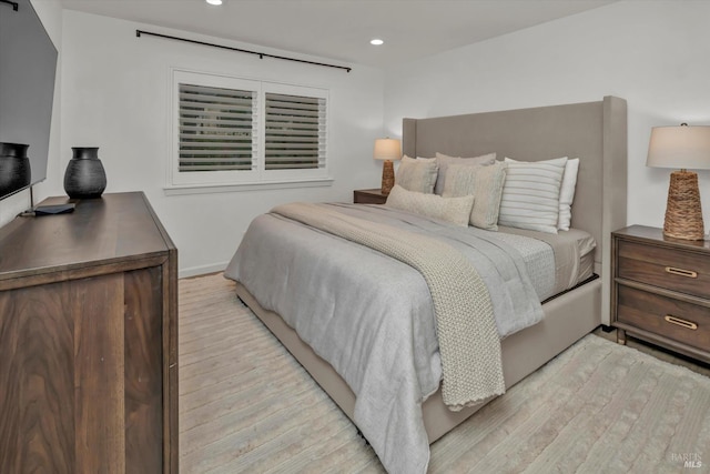 bedroom with light hardwood / wood-style floors