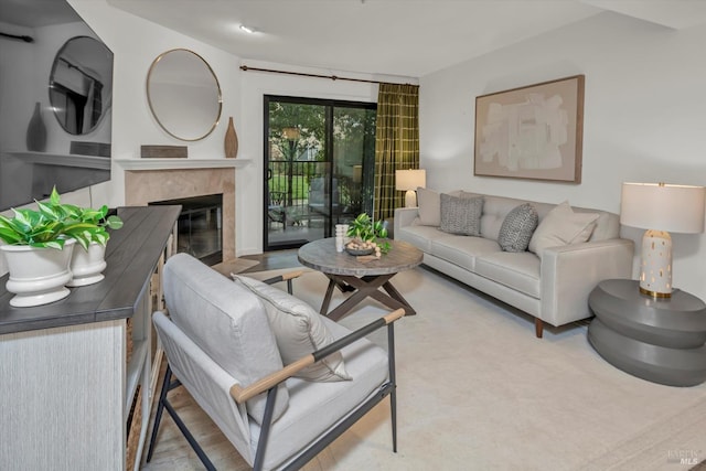 living room featuring a tiled fireplace