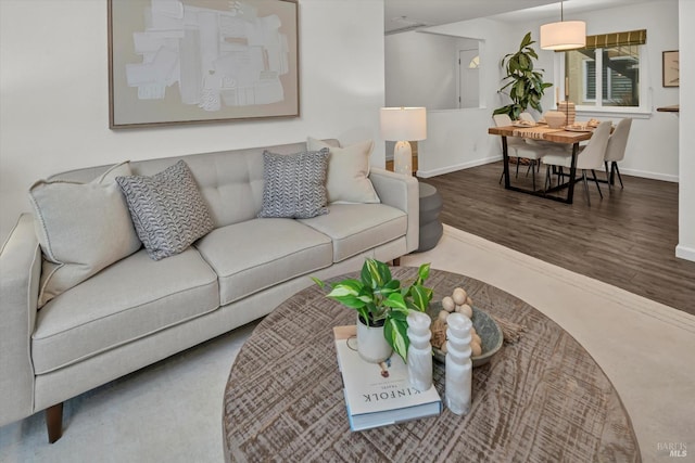 living room with dark hardwood / wood-style floors