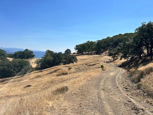 view of road with a mountain view and a rural view