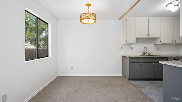 kitchen with a sink, visible vents, appliances with stainless steel finishes, and white cabinetry