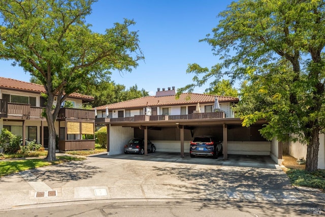 view of front of home featuring a carport