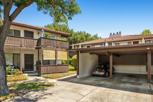 exterior space featuring a carport