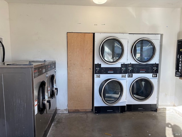 laundry room with stacked washing maching and dryer and washer and dryer