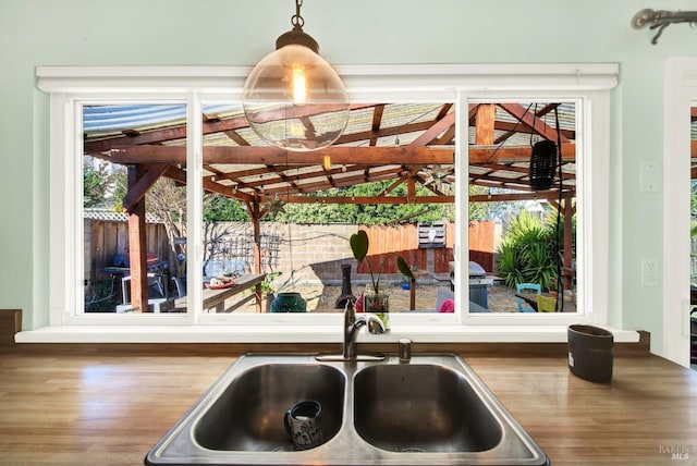 interior details with sink and hanging light fixtures