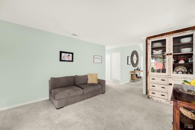 living room featuring light carpet