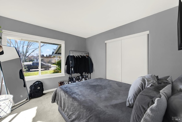 carpeted bedroom with a closet