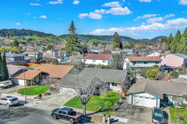 birds eye view of property featuring a mountain view