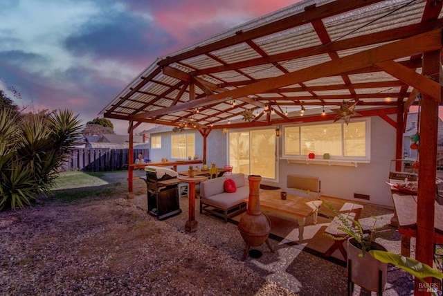 patio terrace at dusk with a pergola