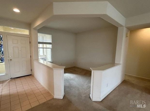 view of carpeted foyer