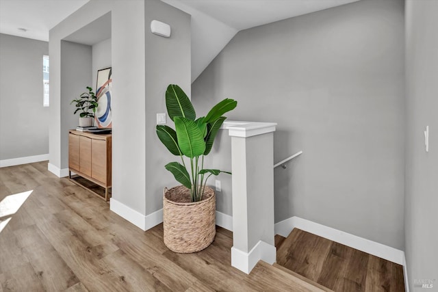 stairway featuring hardwood / wood-style flooring