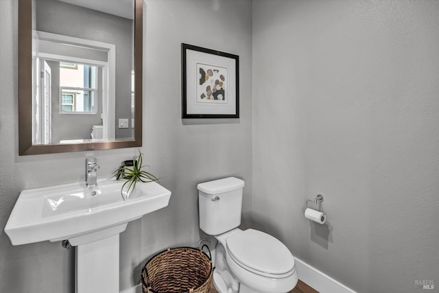 bathroom featuring toilet