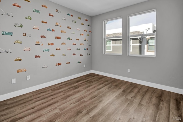 spare room featuring hardwood / wood-style flooring