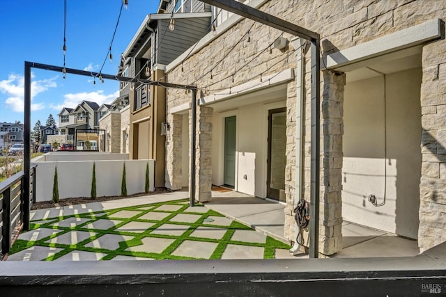 view of side of property featuring a patio
